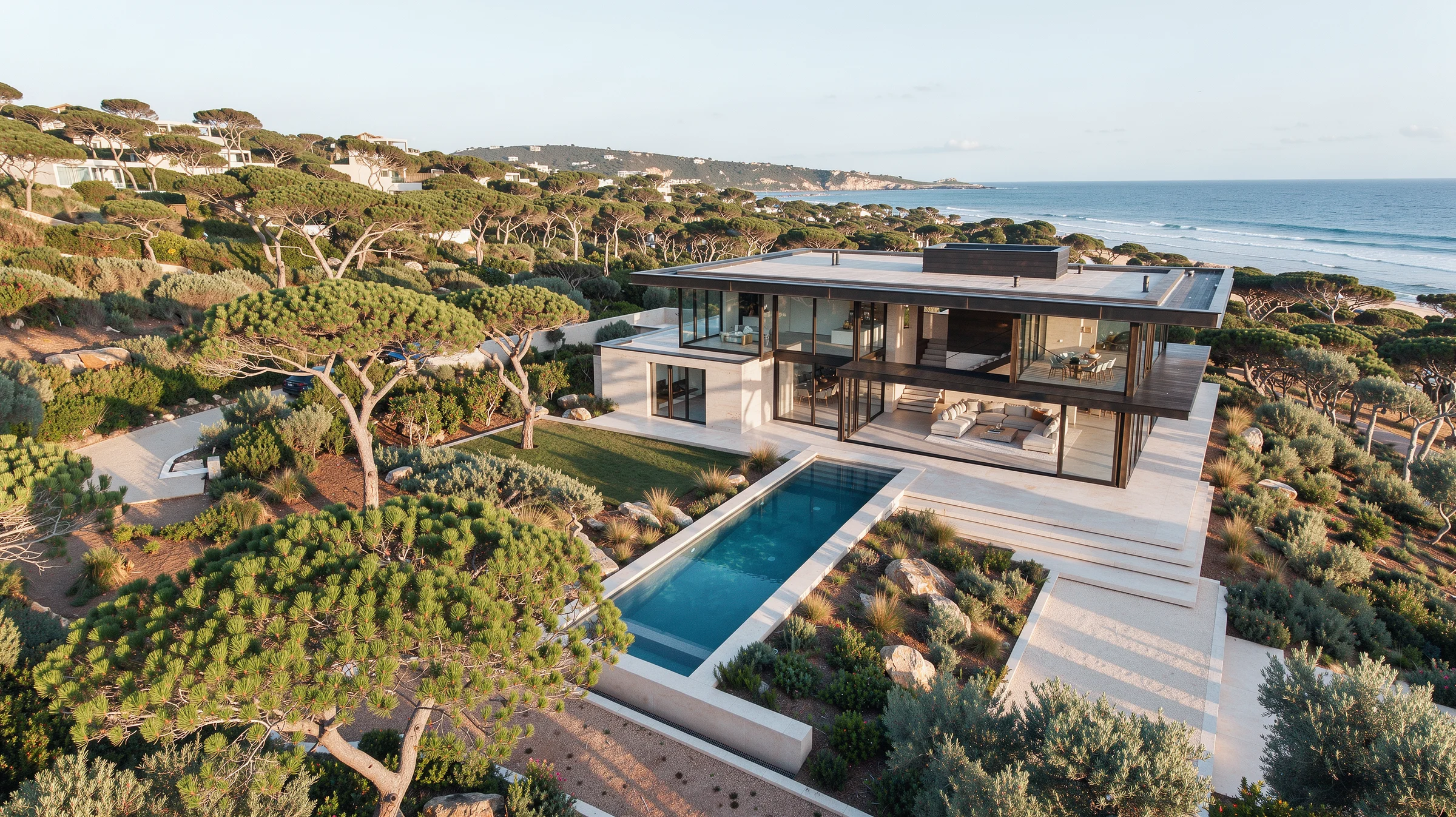 Vista aérea conceptual de una vivienda contemporánea de piedra abierta al paisaje